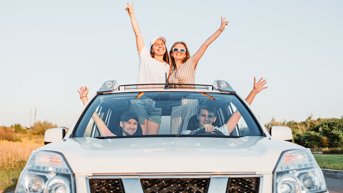Young people having fin in an SUV