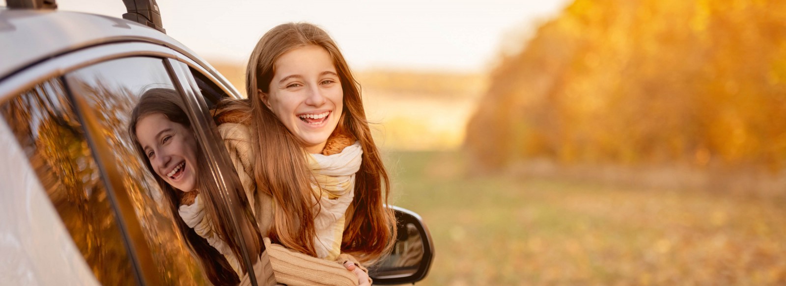 Girl in new car during fall